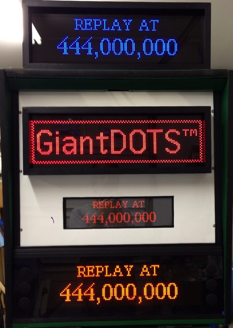 GiantDOTS Displays On our Ad Machine showing Blue, Red and Orange displays, compared to an original Plasma Display.